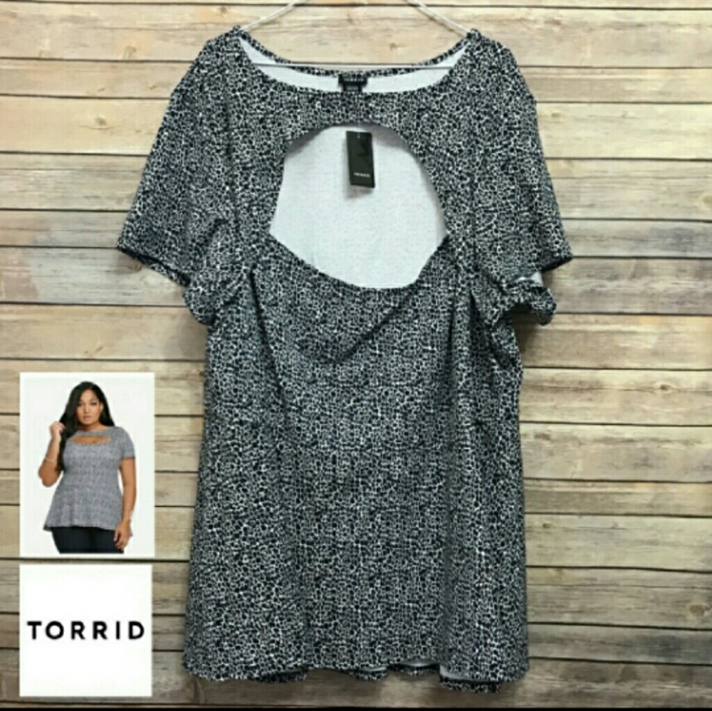 Torrid Peplum Peekaboo Top sz 5 Animal Print